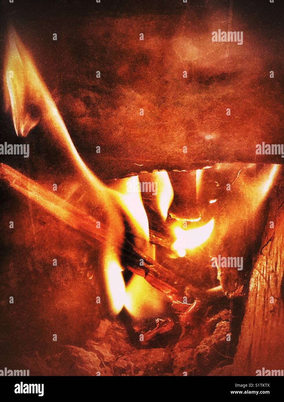 Burning fire flames in a wood stove - Smartphone Captured Stock Image