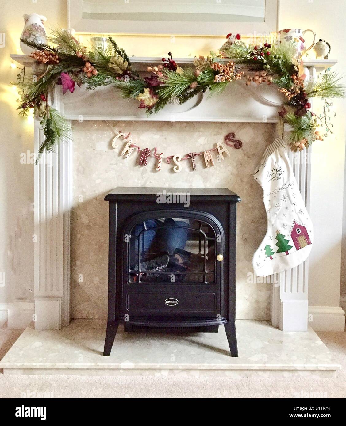 A Modern Fireplace With Wood Burning Stove Decorated For A Stock