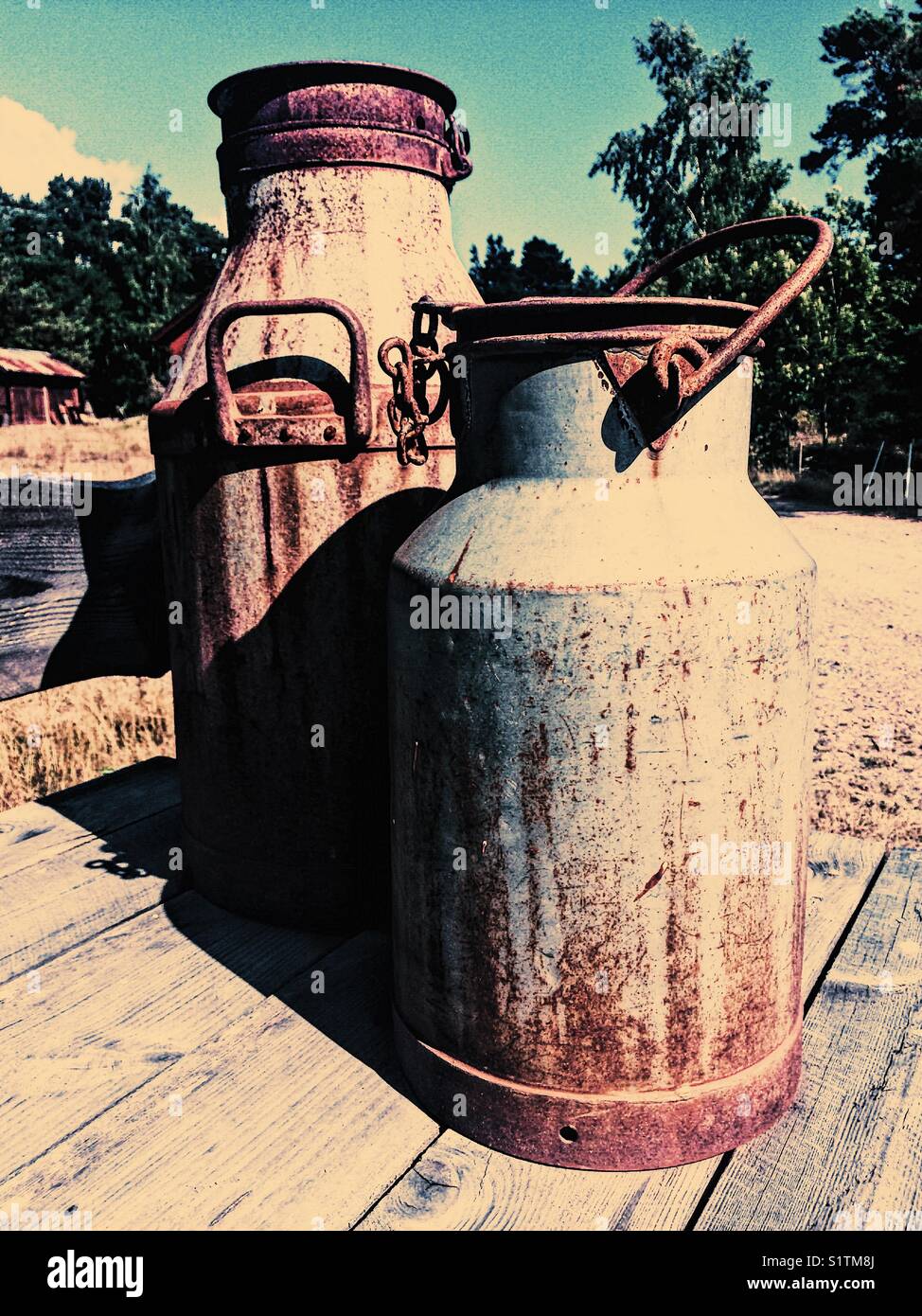 Milk churns outside farm, Ljustero, Sweden, Scandinavia - Smartphone Captured Stock Image