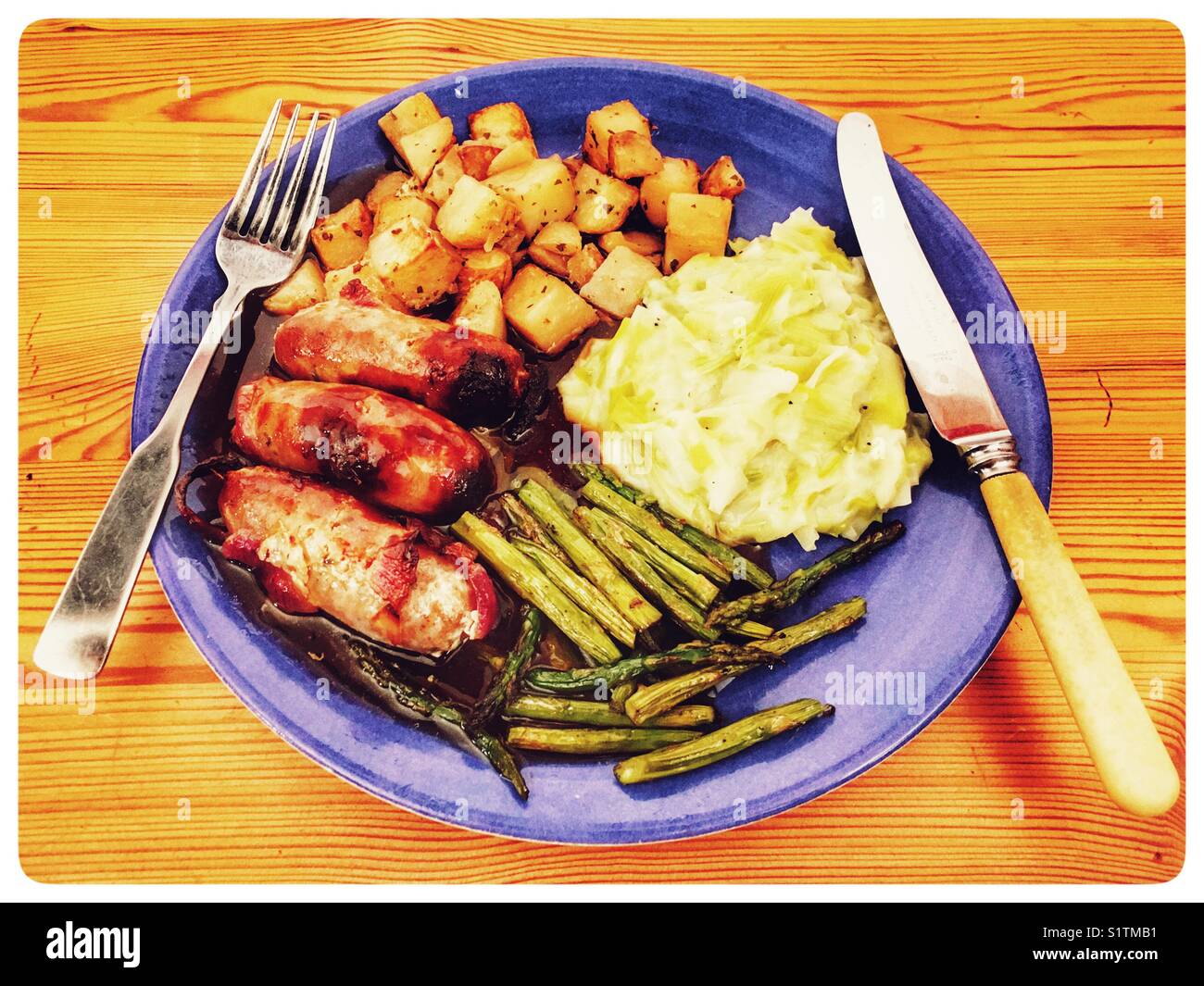 Sausages, Parmentier potatoes, asparagus and leeks in cream sauce Stock