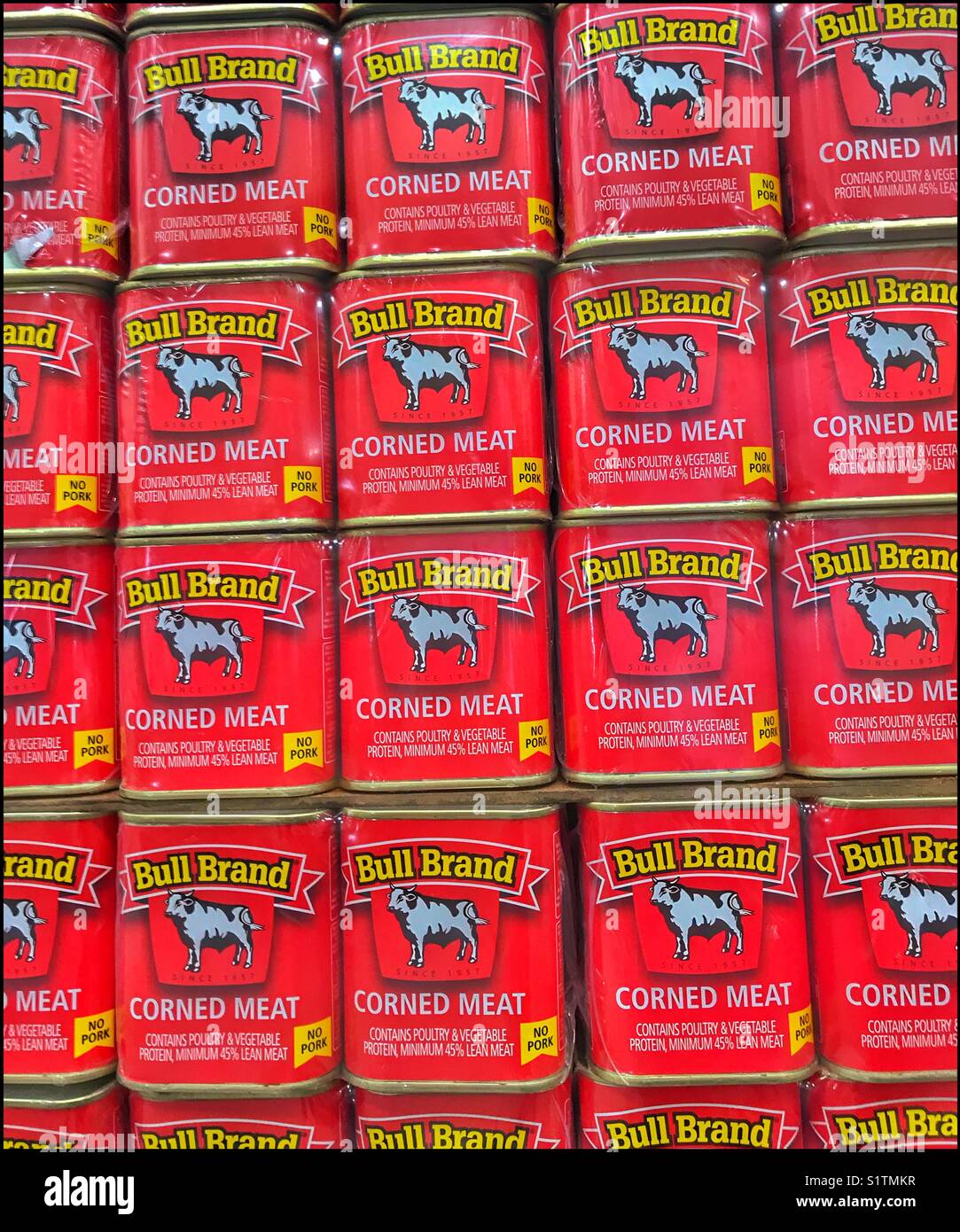 Tins of corned meat on supermarket shelf Stock Photo Alamy
