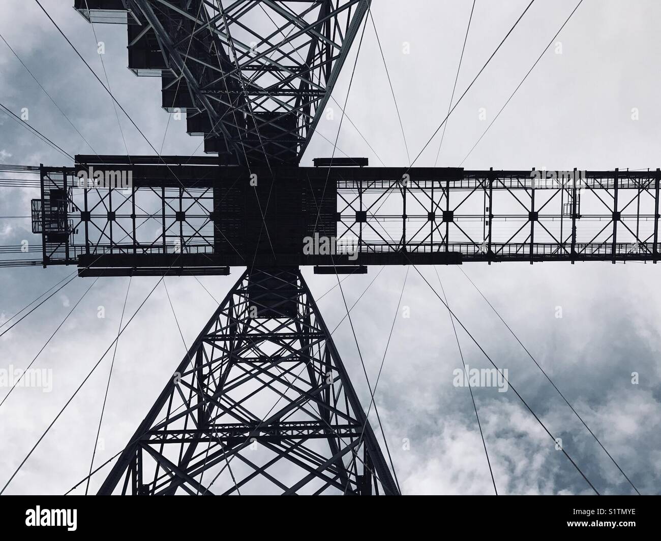 Newport, Wales: View looking up at the huge steel supporting structure of the historic Transporter Bridge Stock Photo