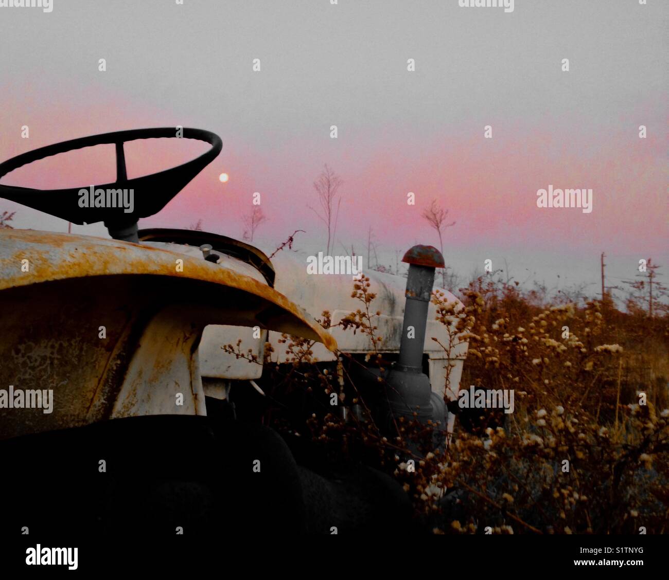 Tractor and morning full moon - Smartphone Captured Stock Image