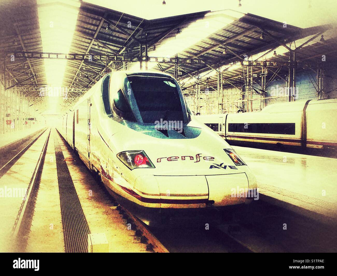 Speed train Renfe Ave at Malaga railway station, Spain Stock Photo
