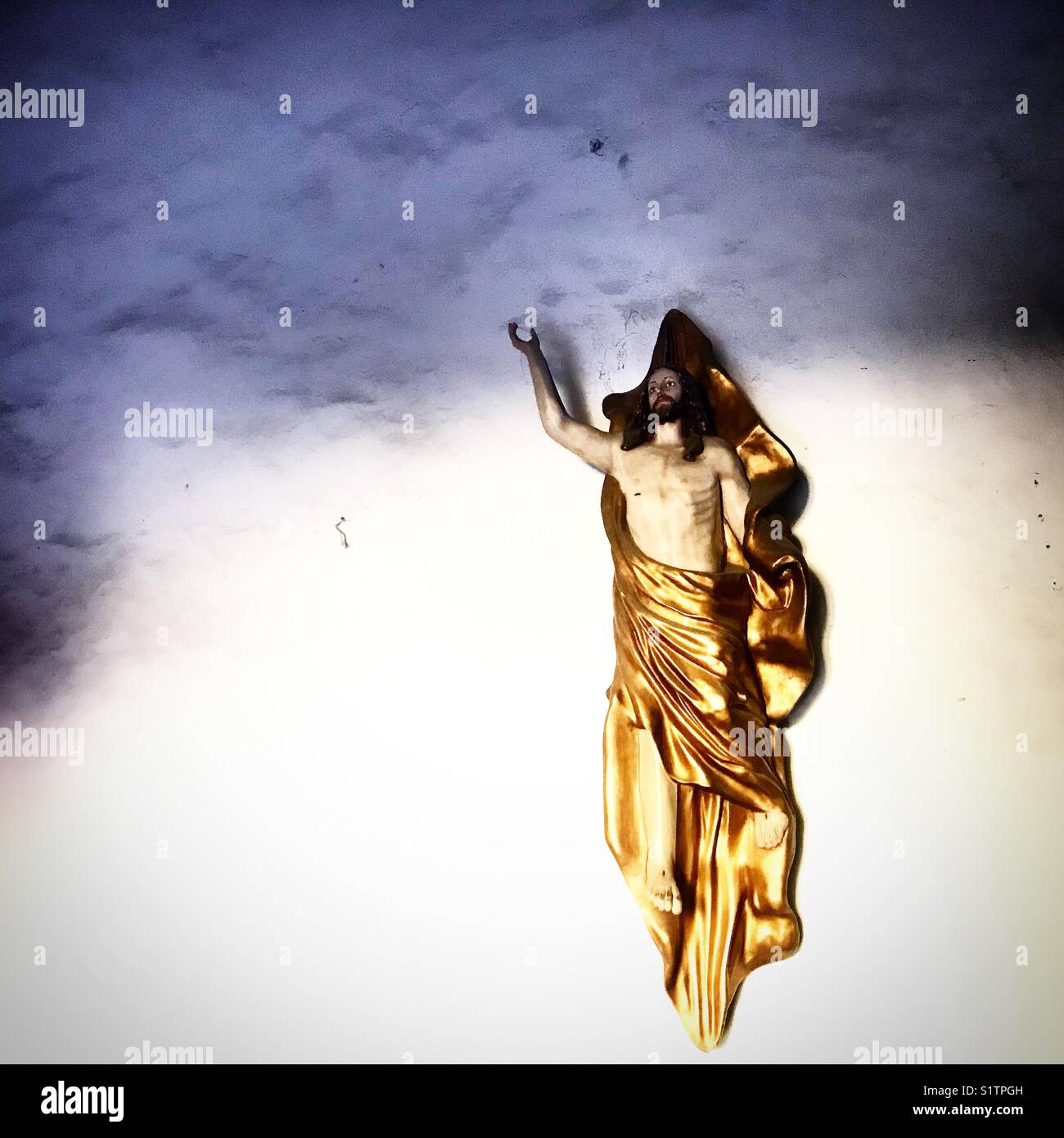 A sculpture of Jesus Christ ascending to heaven decorates a church in Oaxaca, Mexico - Smartphone Captured Stock Image