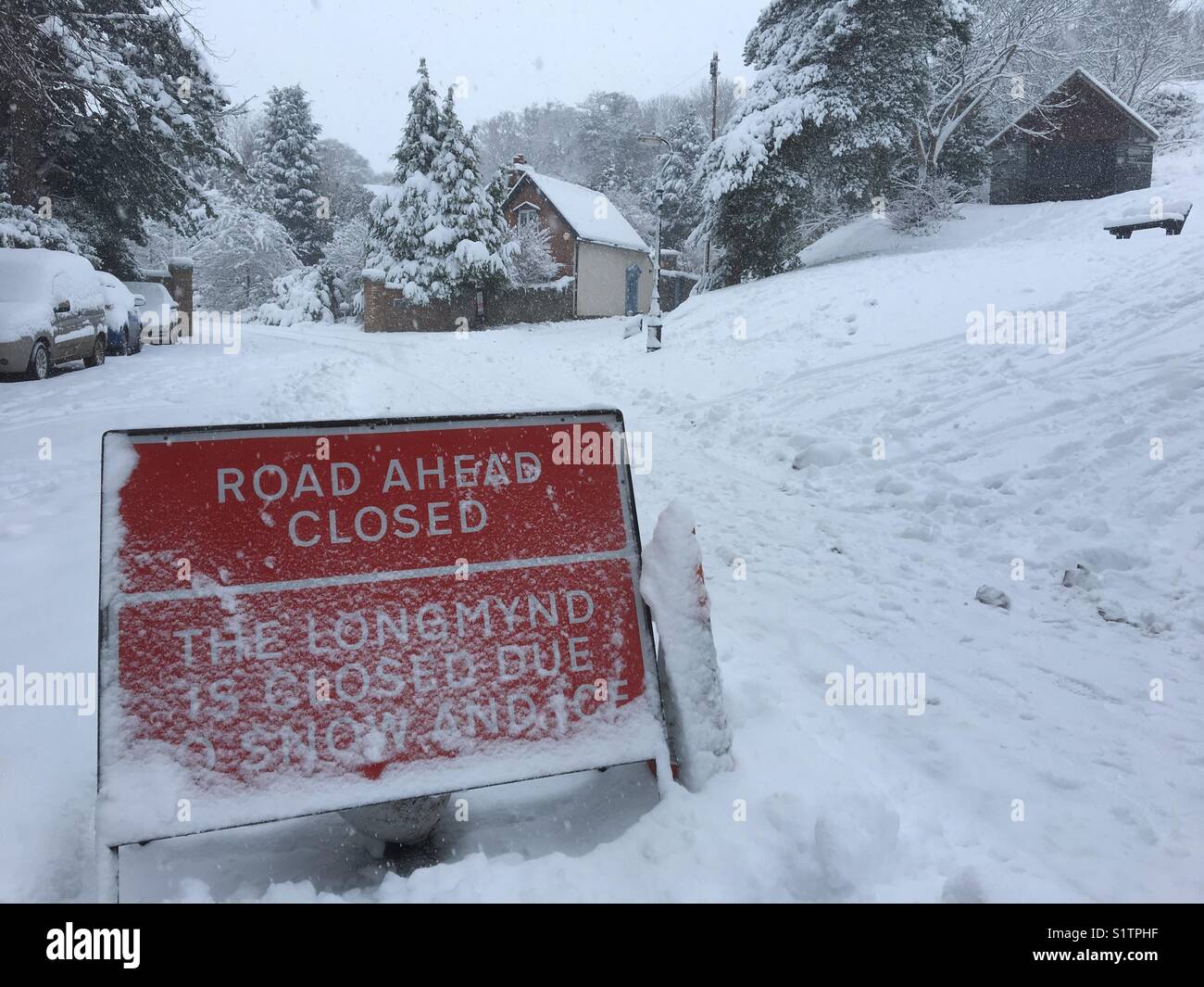 Warning sign regarding snow closure on The Burway and The Long Mynd in Church Stretton, Shropshire - Smartphone Captured Stock Image