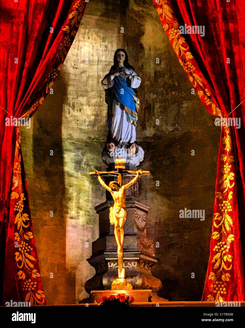 An Altar Decorated With Red Curtains An Image Of Jesus Christ