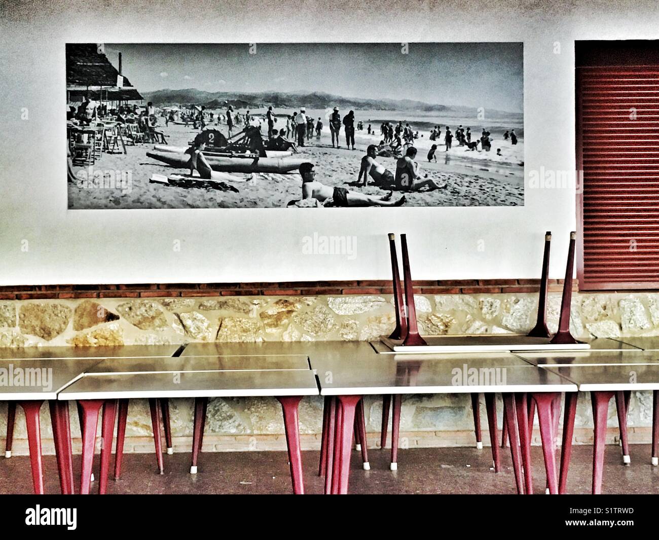 Empty bar with beach photography, Malaga, Spain - Smartphone Captured Stock Image