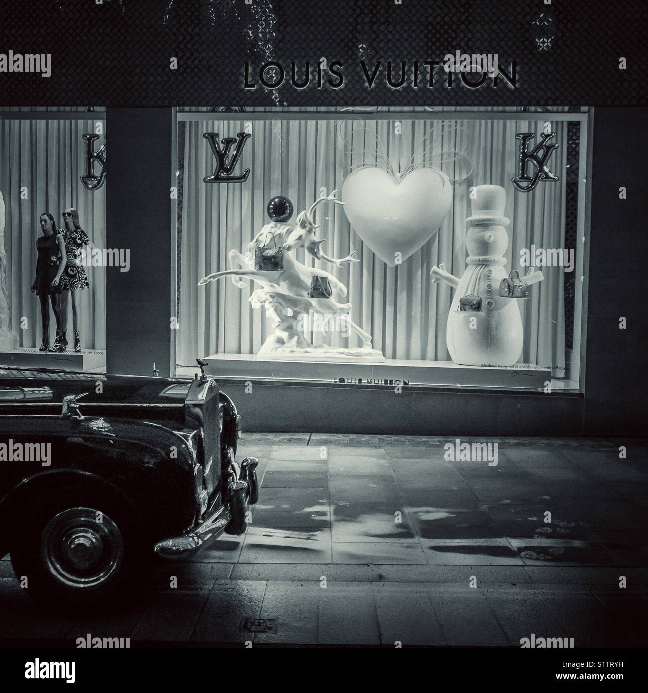 Rolls Royce parked outside Louis Vuitton store in Bond Street, London at Christmas - Smartphone Captured Stock Image