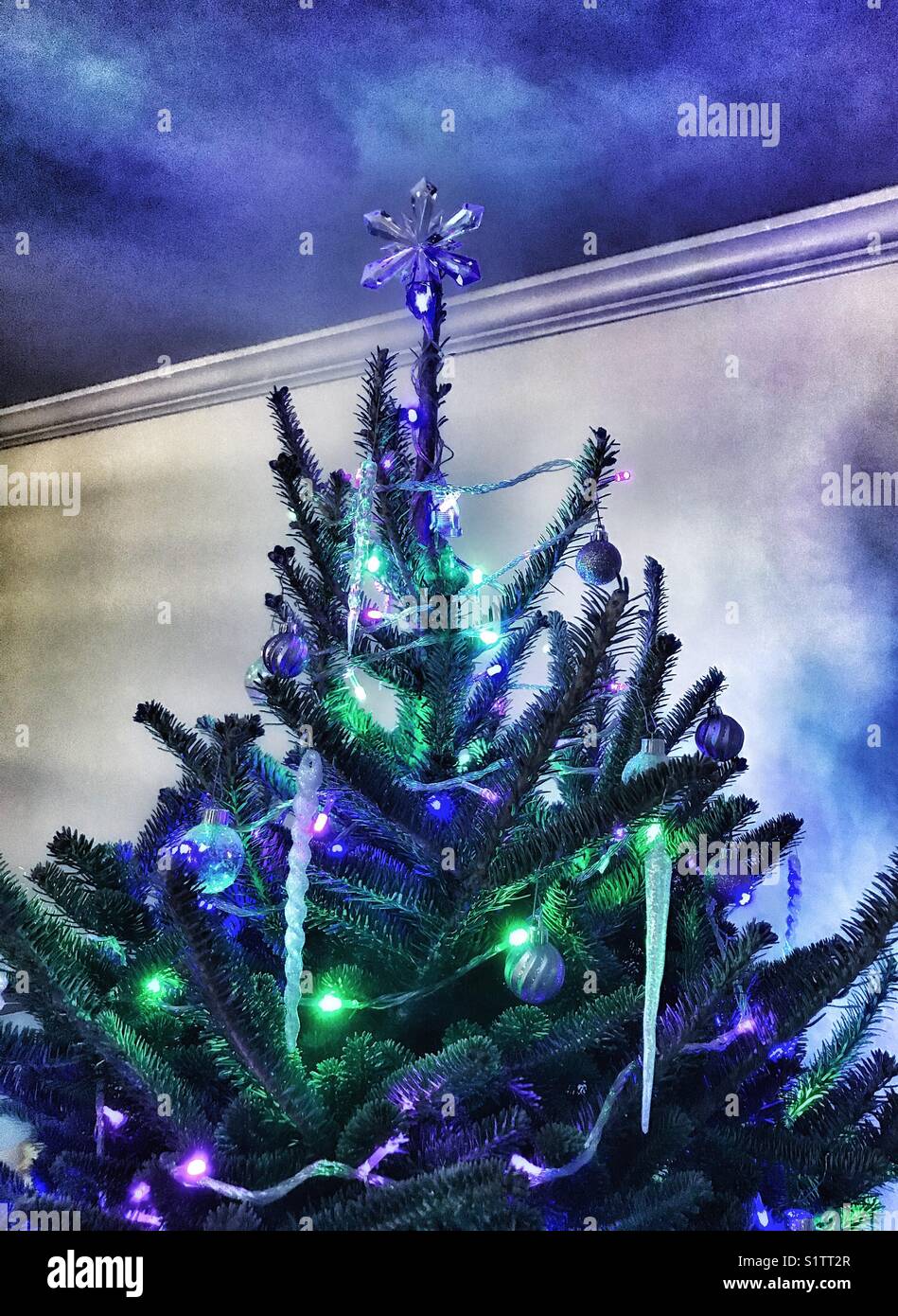 Decorated Christmas tree with crystal star on top - Smartphone Captured Stock Image