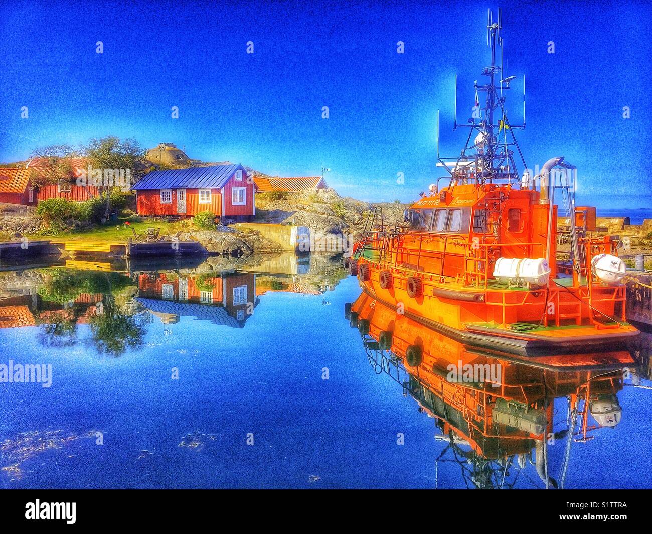 Pilot boat docked in Vasterhamn (west harbour) on the island of Oja at the southern end of the Stockholm archipelago, Sweden, Scandinavia - Smartphone Captured Stock Image