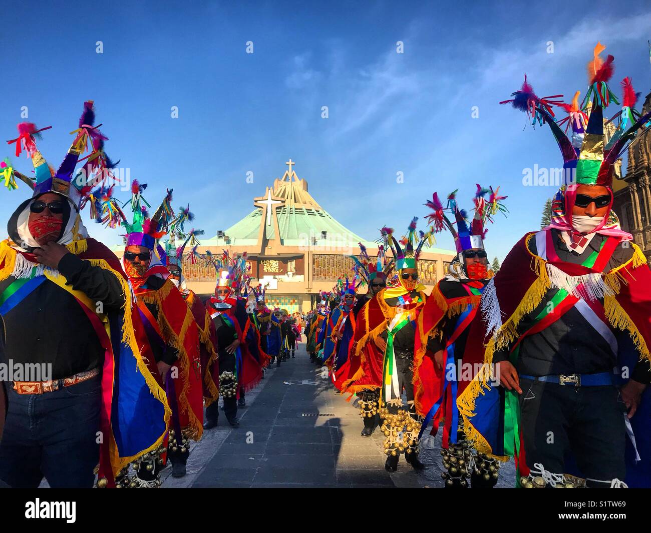 Danzantes perfom during the annual pilgrimage to Our Lady of Guadalupe basilica in Mexico City, Mexico Stock Photo