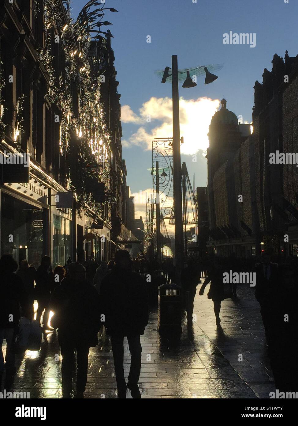 Christmas Shopping silhouettes in the main shopping area of Buchanan Street, Glasgow, Scotland - Smartphone Captured Stock Image