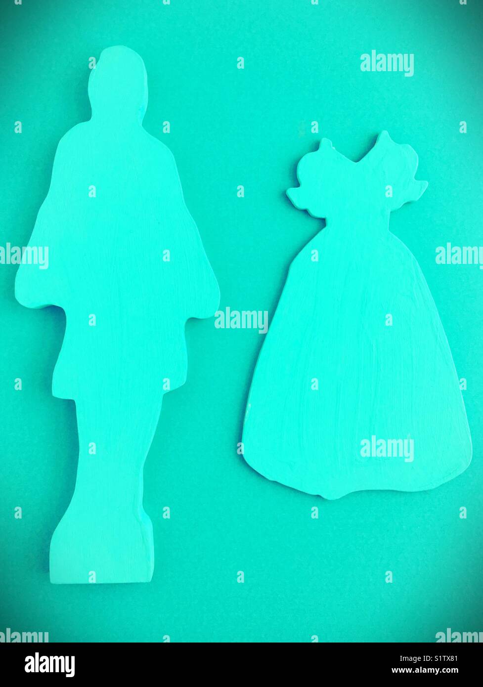 Monochrome cutout figures of a female form and a dress. Stock Photo