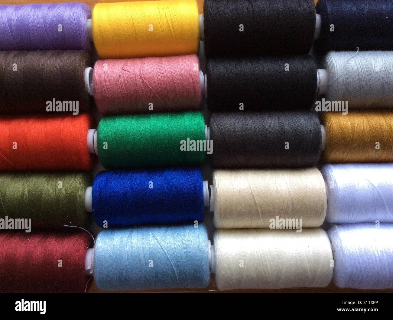 Colorful yarn spools Stock Photo - Alamy
