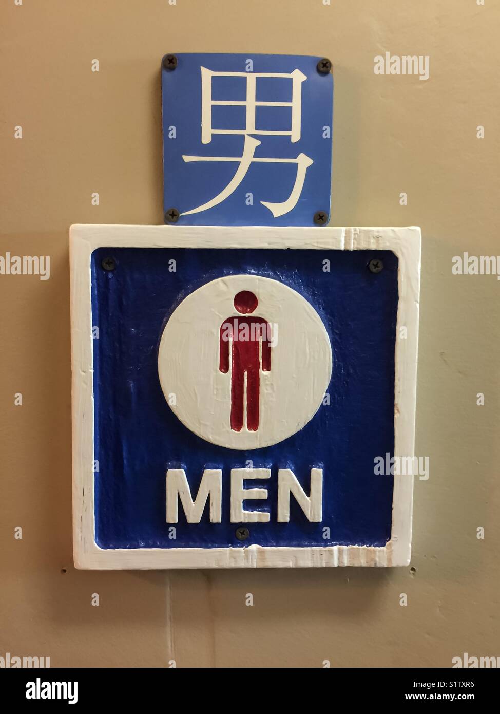 Men’s, a pictograph and sign in English and Chinese Stock Photo