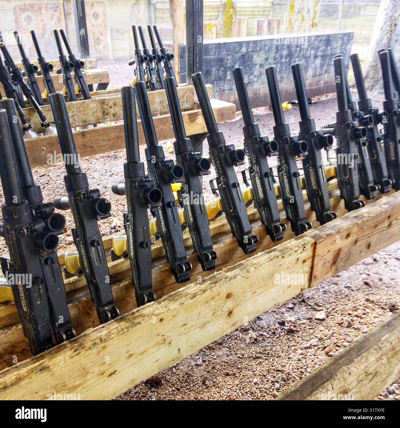 Rack of semiautomatic paintball guns Stock Photo