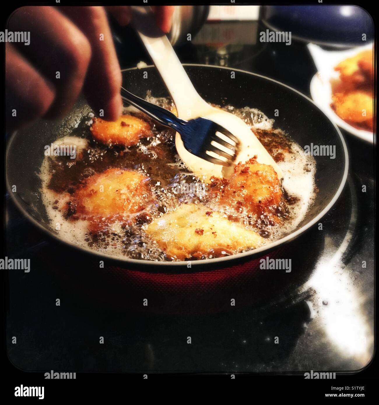 Making potato pancakes Stock Photo