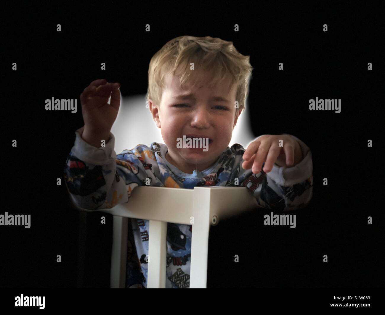 Boy crying in bed hires stock photography and images Alamy