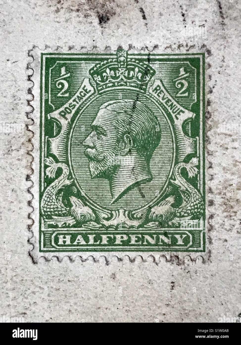 Old halfpenny stamp from around 1917. Stock Photo