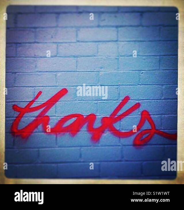 Thanks message graffitied on wall - Smartphone Captured Stock Image