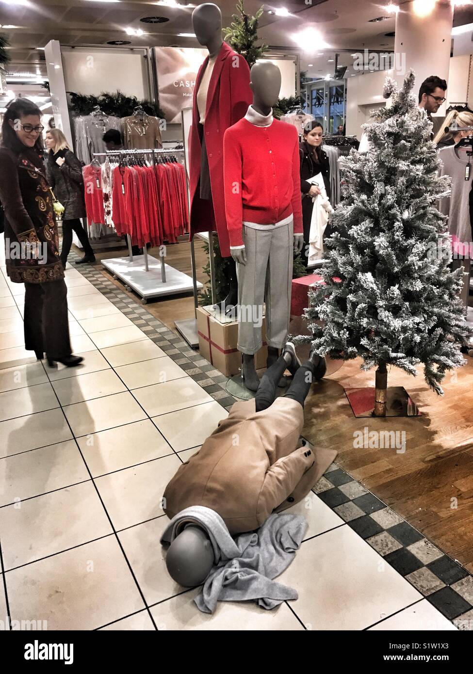 A mannequin which has fallen over in Marks and Spencer in London, England on December 21 2017 - Smartphone Captured Stock Image