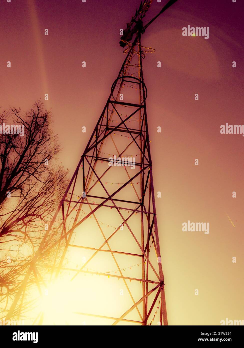 Farm windmill with sunset glow - Smartphone Captured Stock Image