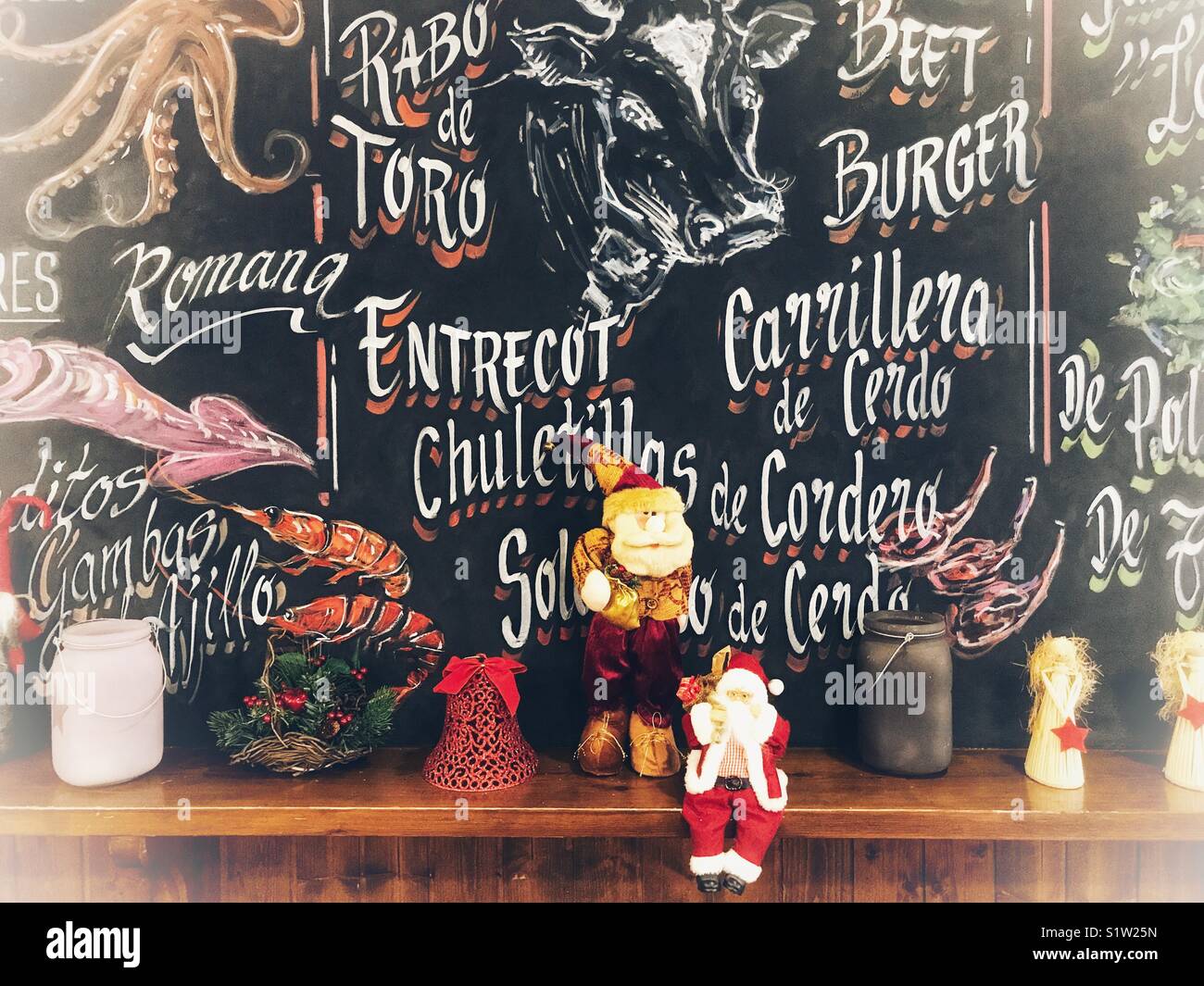 Blackboard wall used as an illustrated menu board in s tapas bar in