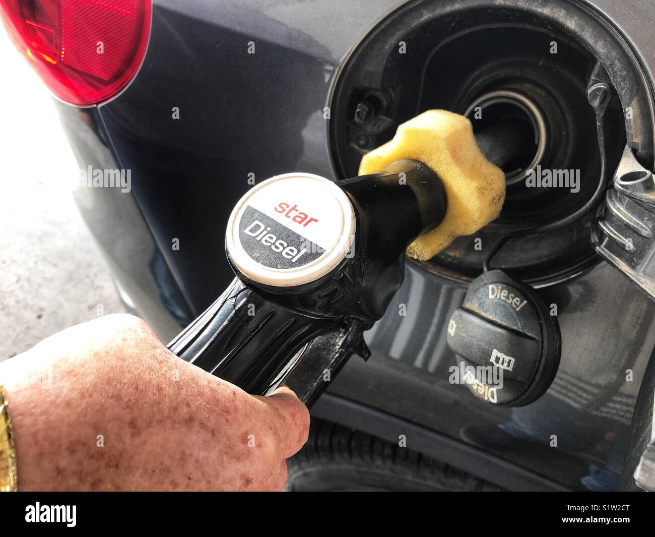 Filling diesel at a gas station Stock Photo