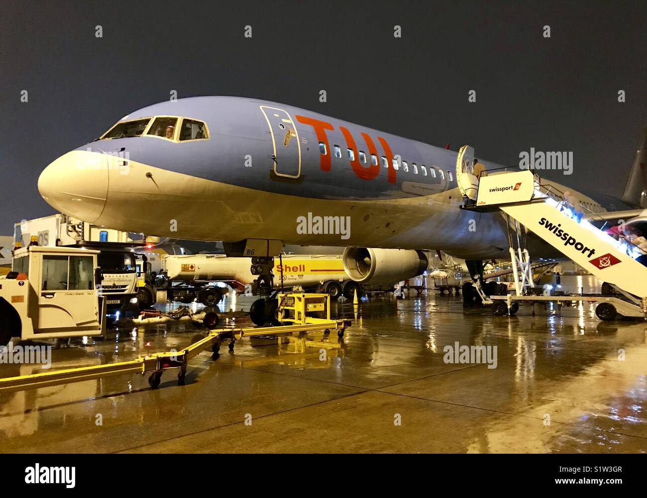 Holiday jet early morning in wet weather Stock Photo