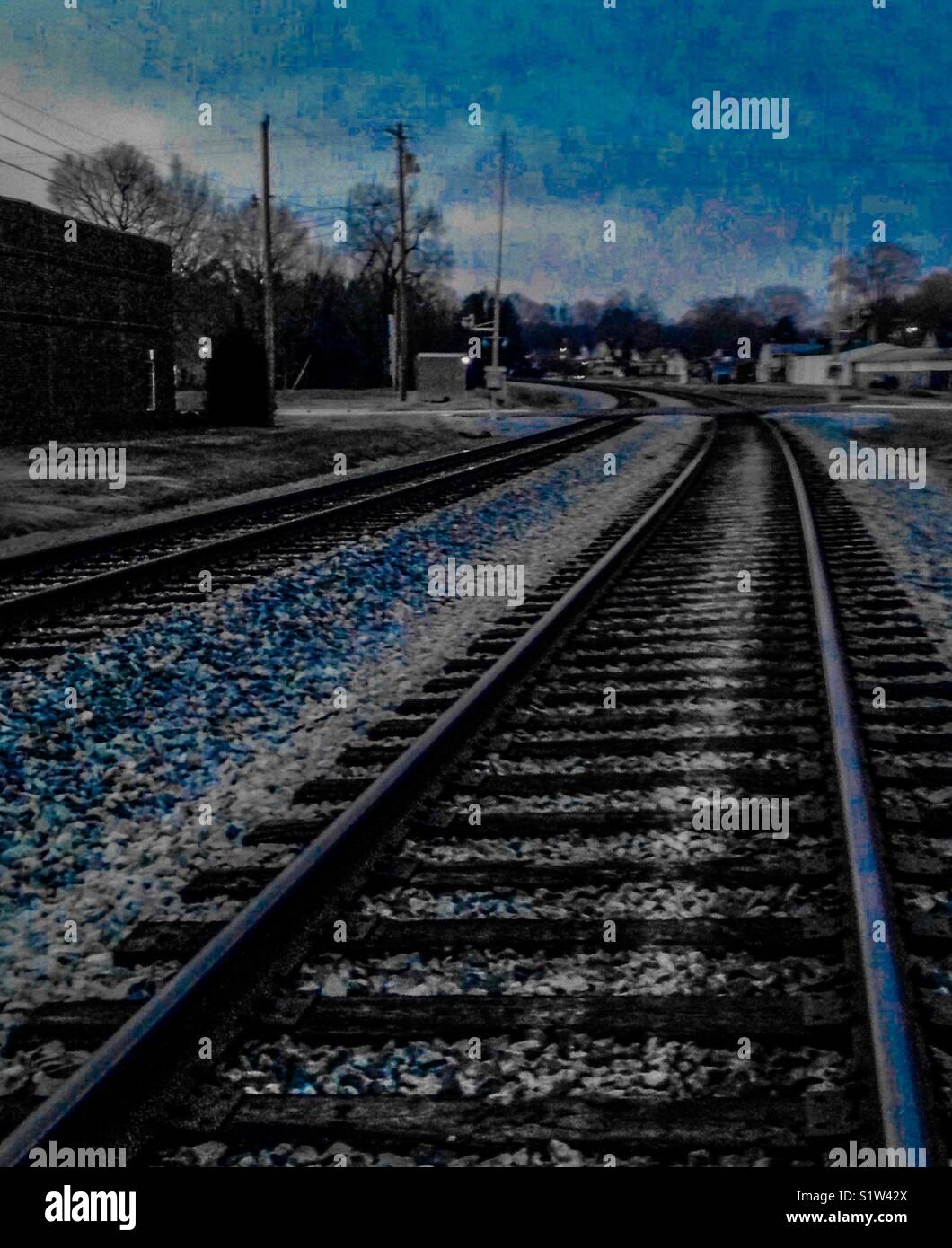 Blue color pop duel railroad tracks before the curve - Smartphone Captured Stock Image