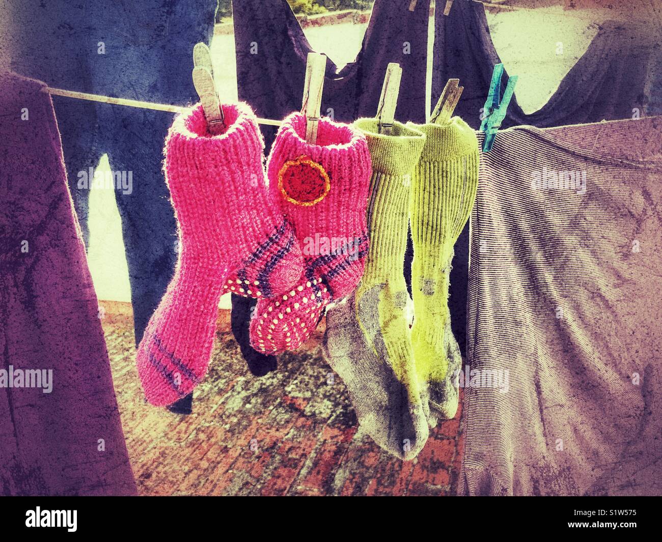 Laundry hanging on the washing line, drying in the sun Stock Photo