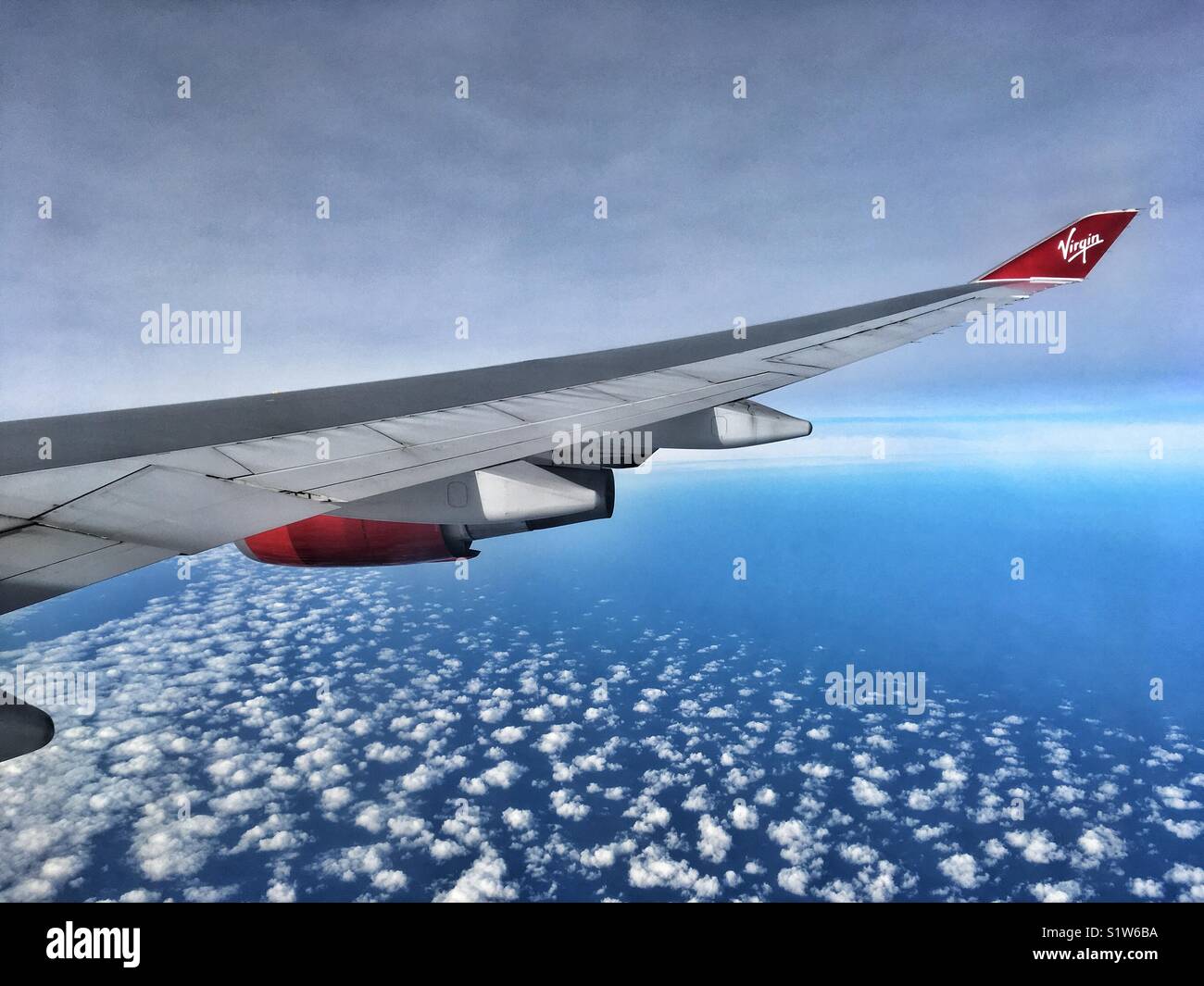 View out over the wing of a Virgin Atlantic airliner Stock Photo