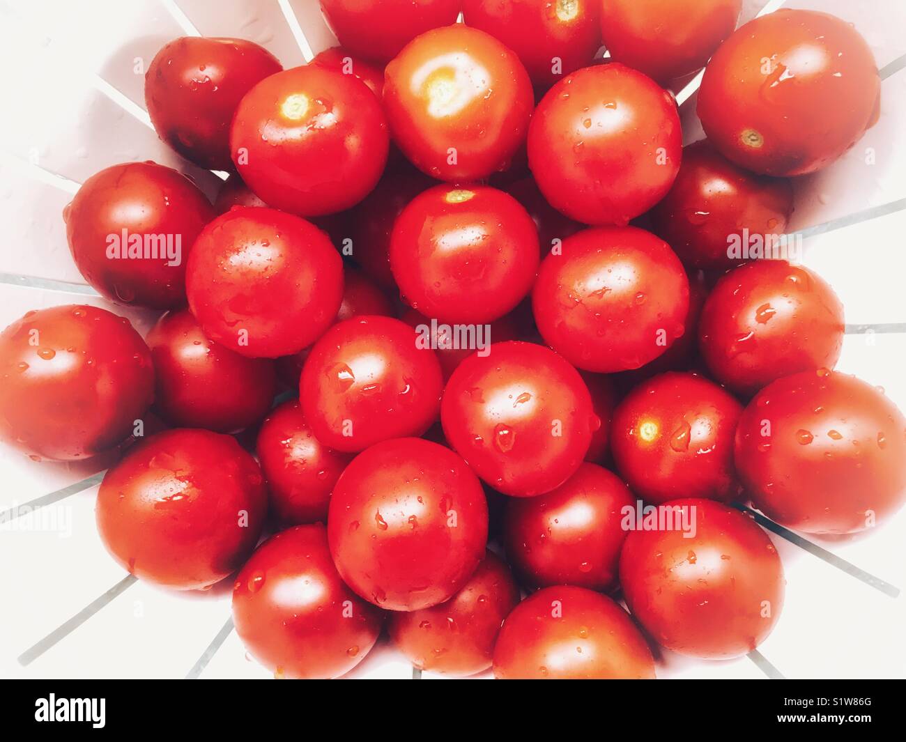 Cherry tomatoes, in a colander, high angle view - Smartphone Captured Stock Image
