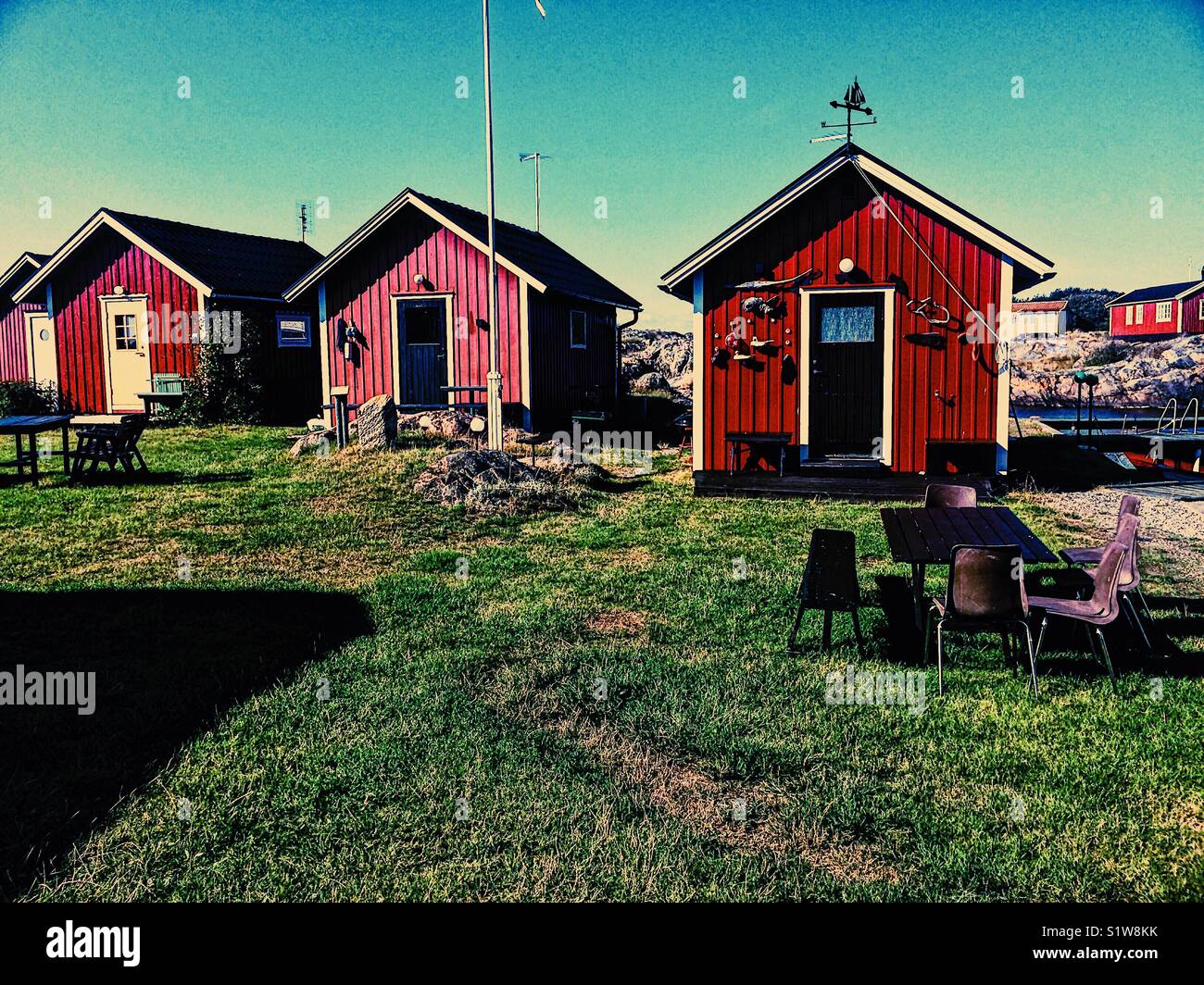 Timber summer cabins on the island of Oja at the southern end of the Stockholm archipelago, Sweden, Scandinavia - Smartphone Captured Stock Image
