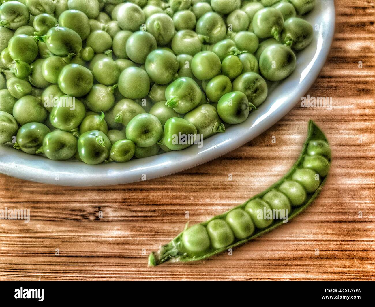 Peas in a bowl and peas in a pod - Smartphone Captured Stock Image