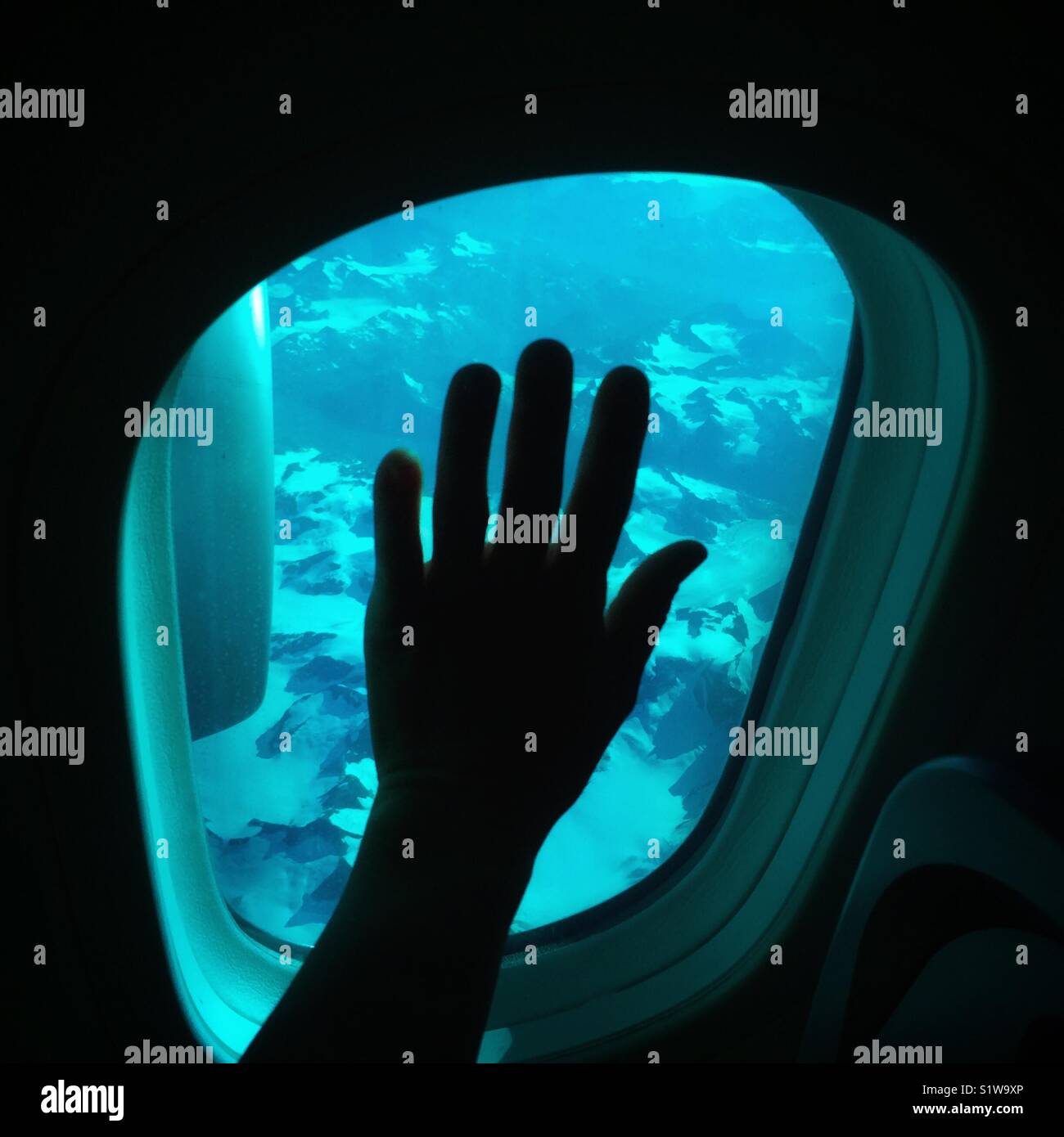 Looking out the window on an Boeing 757 airplane over Greenland (Groenland) during a transatlantic flight. - Smartphone Captured Stock Image