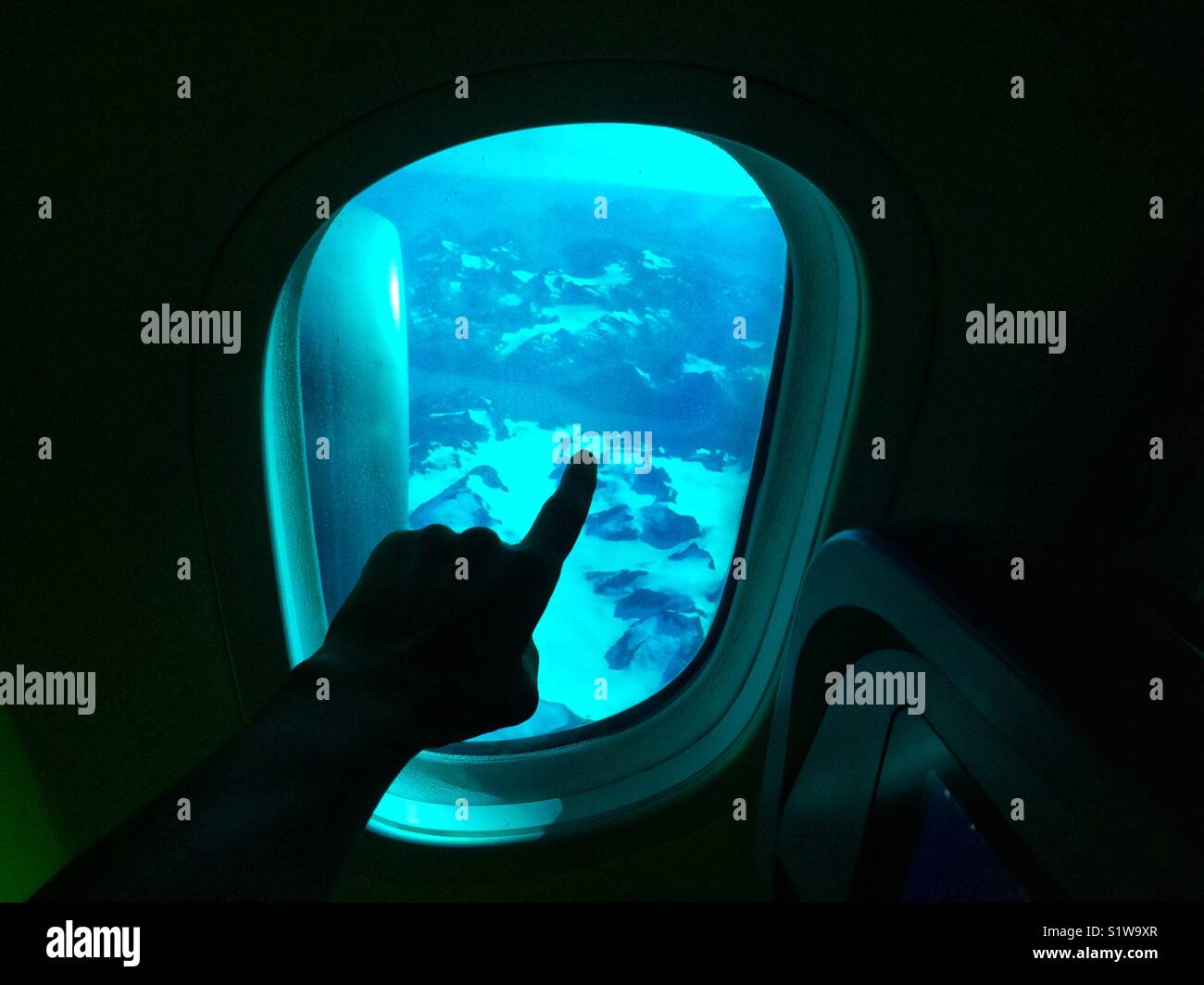 Looking out the window on an Boeing 757 airplane over Greenland (Groenland) during a transatlantic flight. - Smartphone Captured Stock Image