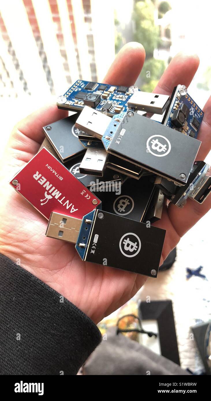 Bitcoin USB ASIC Erupter Miner on hand Stock Photo - Alamy