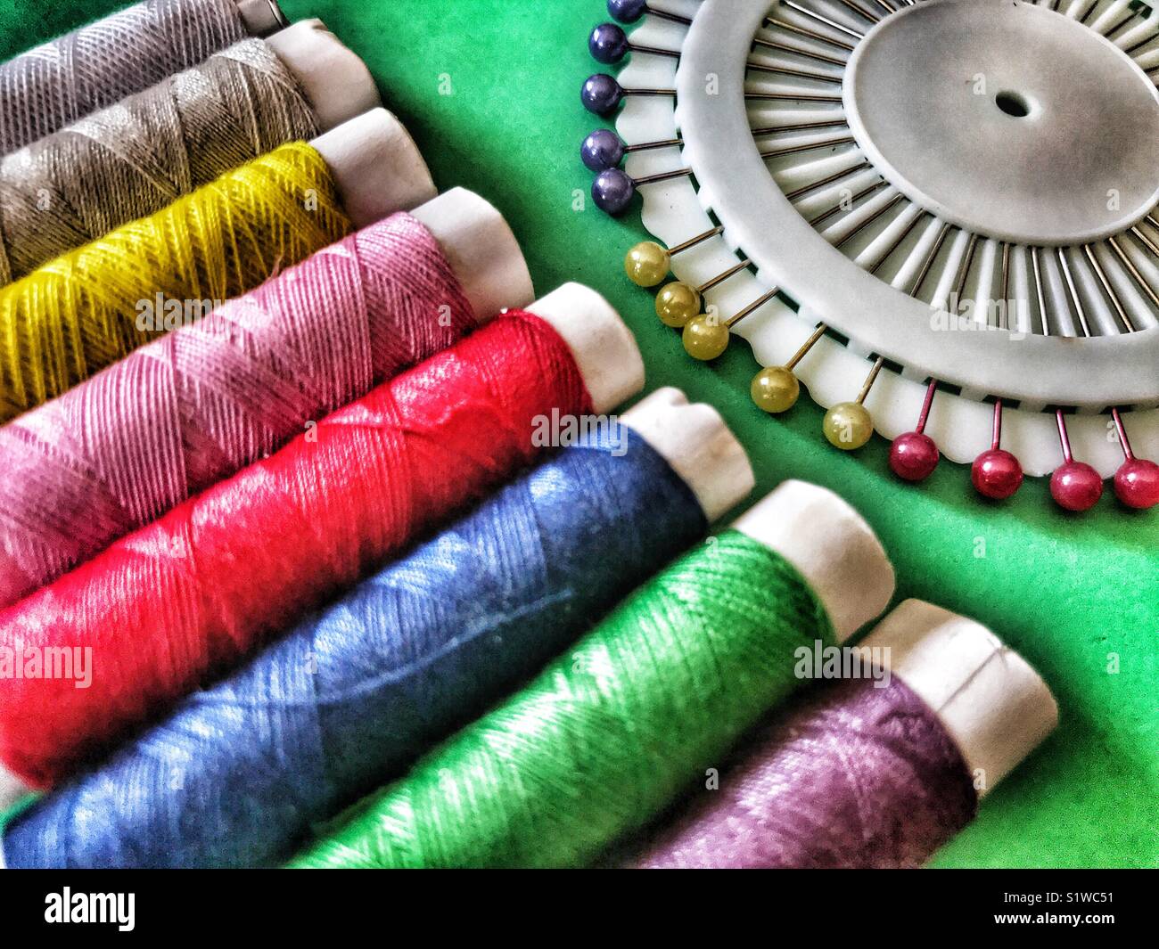 Colourful sewing threads and pin wheel Stock Photo Alamy