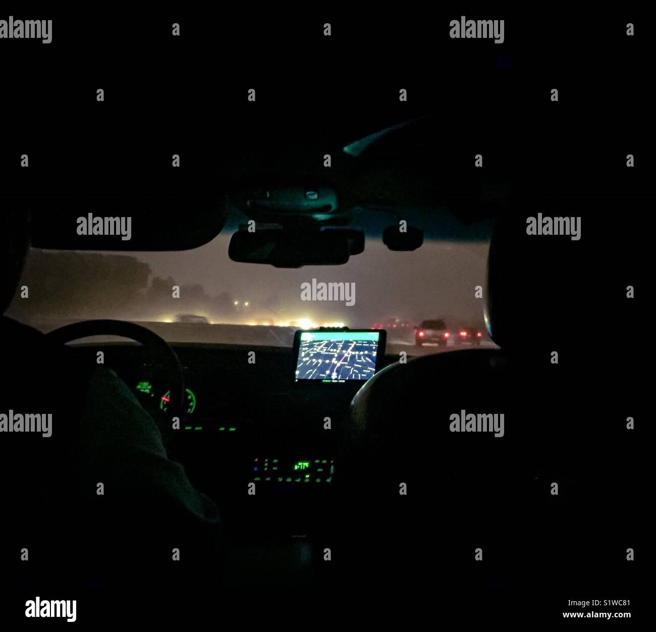 Night Driving in snow storm - Smartphone Captured Stock Image