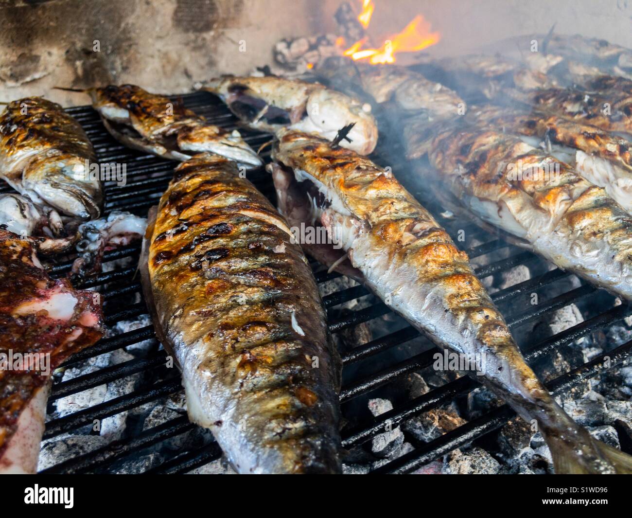 Mackerel fish on the grill close up Stock Photo