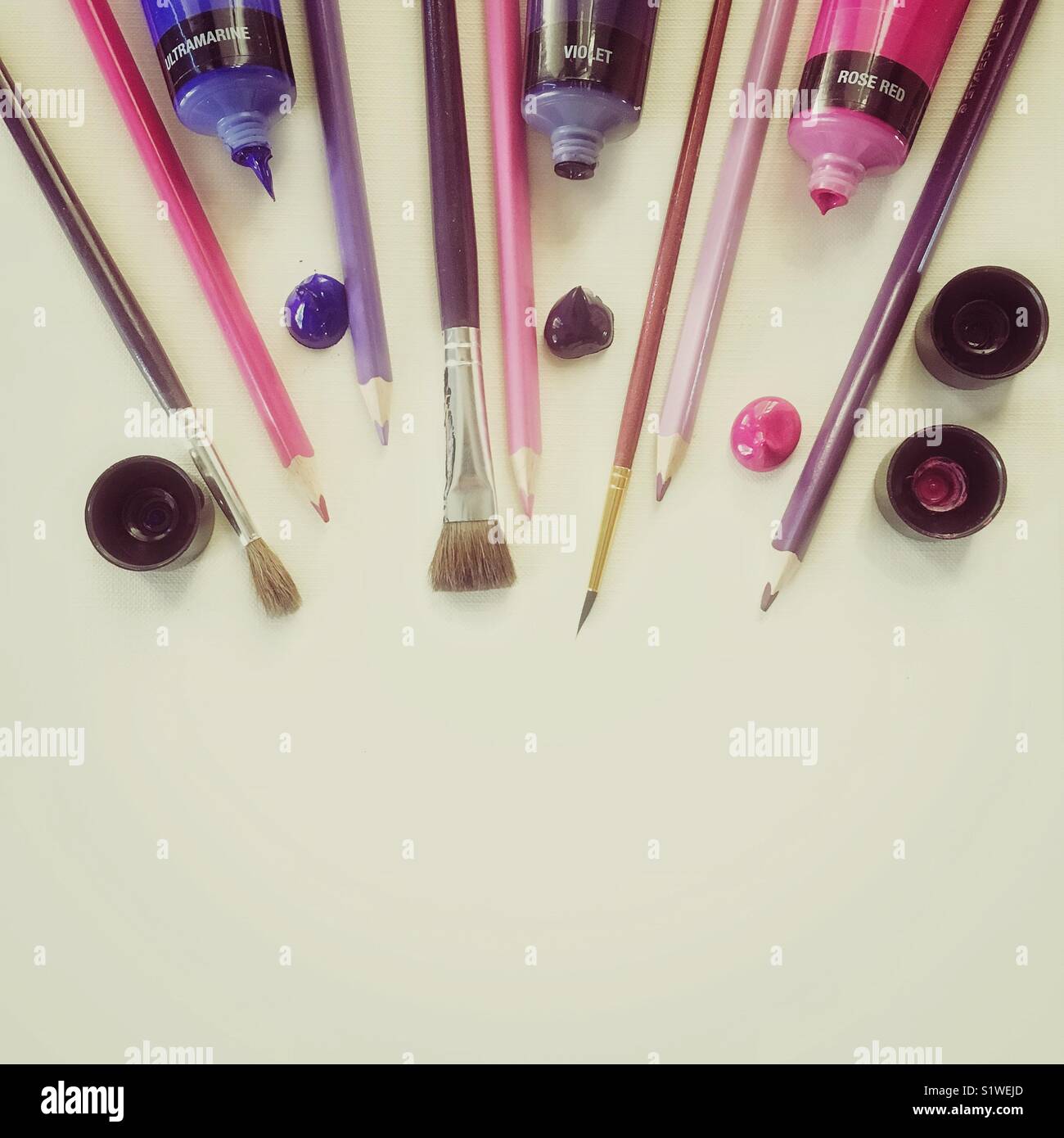 Artist’s workplace with brushes, pencils and acrylic paint - Smartphone Captured Stock Image