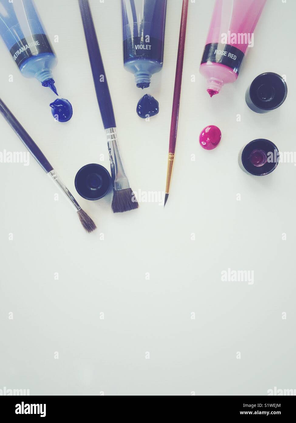 Artist’s workplace with brushes, pencils and acrylic paint - Smartphone Captured Stock Image