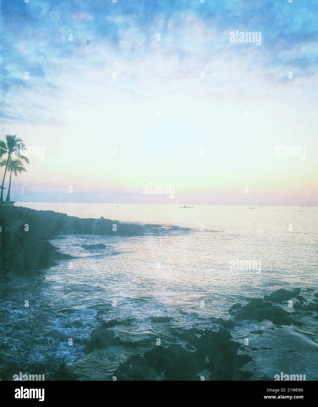 Book cover photo of Pacific Ocean bay in kona Hawaii at sunset. - Smartphone Captured Stock Image