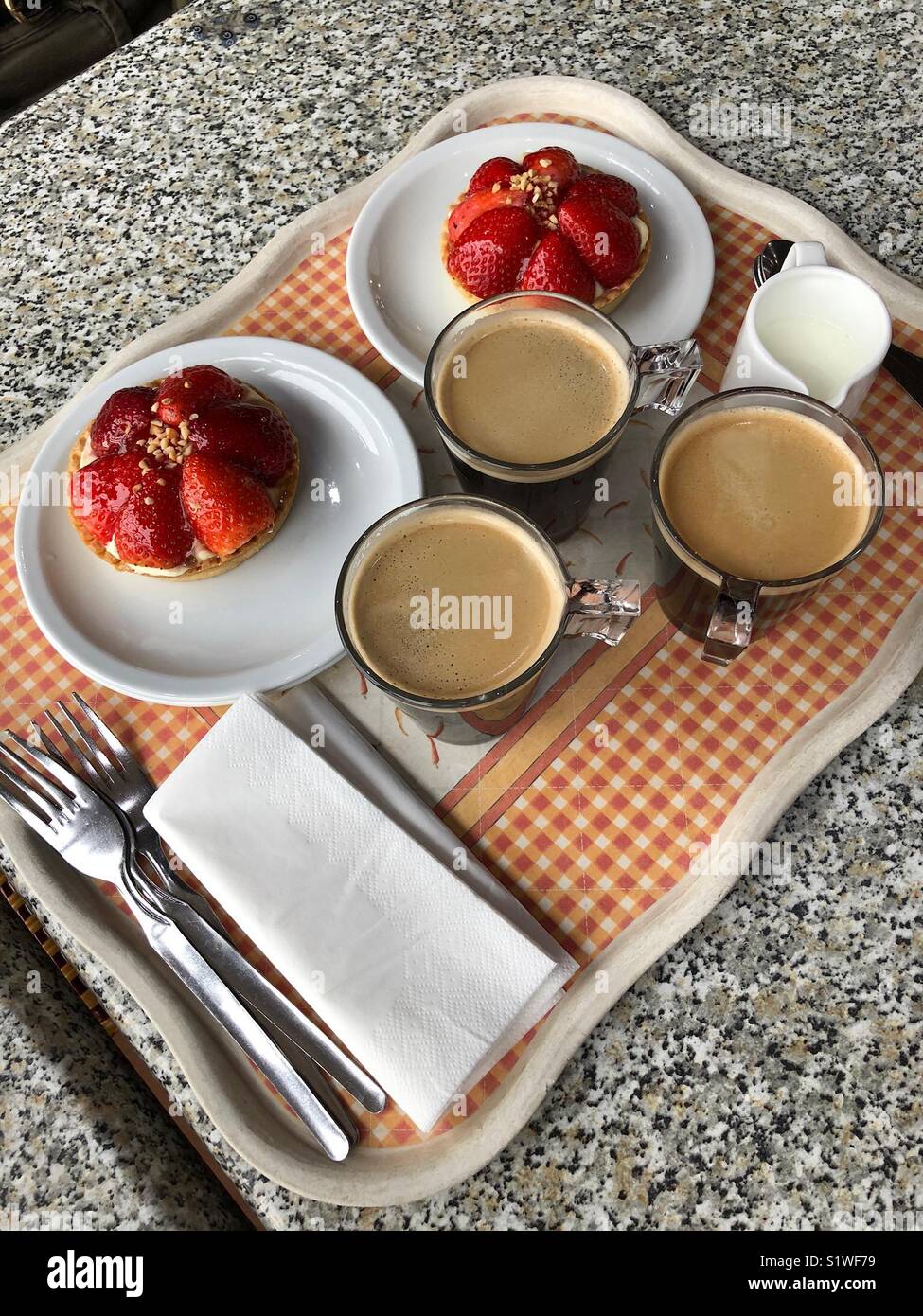 Coffees with strawberry tarts Stock Photo