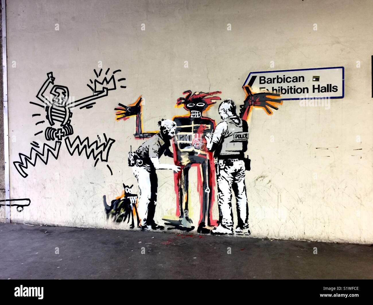 Street art by Banksy, homage to Jean-Michel Basquiat exhibit at the  Barbican Center, London. September 2017 Stock Photo - Alamy