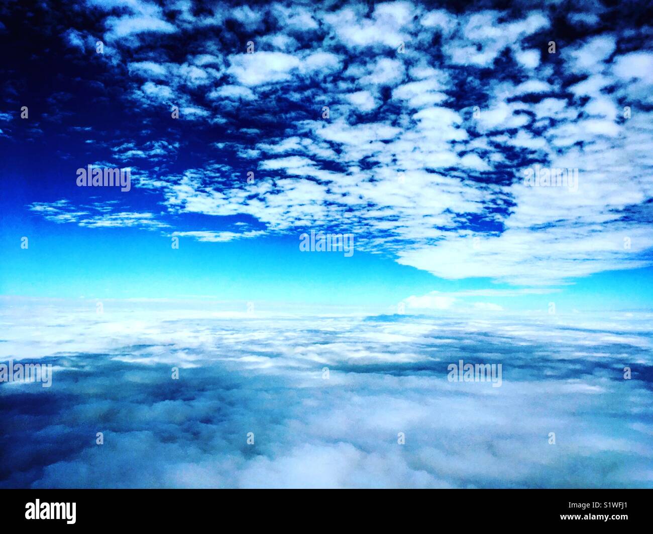 blue sky and clouds from airplane - Smartphone Captured Stock Image