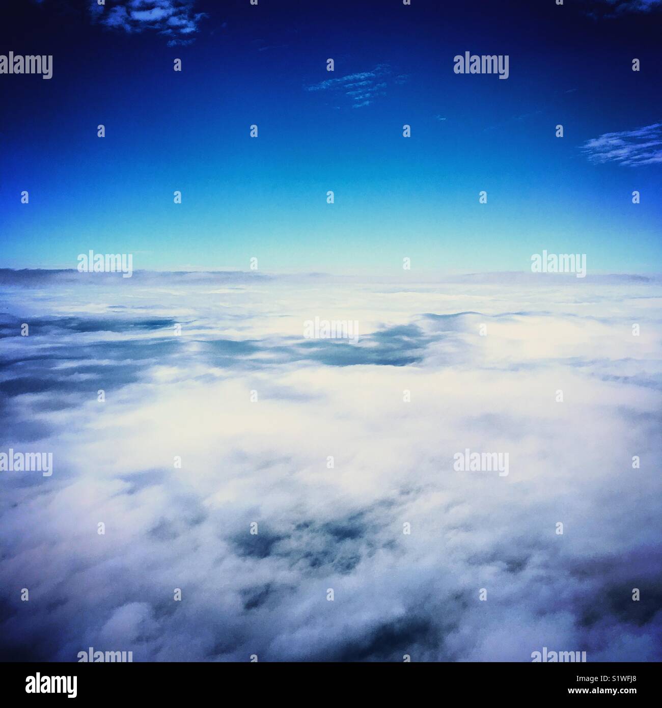 foogy sky and clouds view from top from plane - Smartphone Captured Stock Image