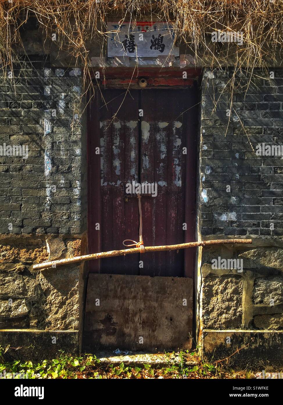 Derelict green brick house, San Tau, Tung O Ancient Trail, Lantau Island, Hong Kong - Smartphone Captured Stock Image